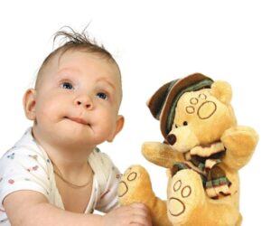 The boy plays with a toy